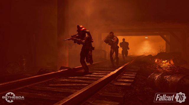A group of three players runs down a red, underground railway tunnel with guns drawn