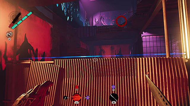 The player character looking at a lever on a second-story from a brightly lit and colored room.