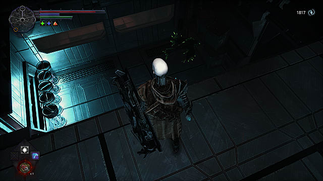 The player stands on a metal ledge overlooking a room with green fish enemies and clear cylinders of bright blue light.