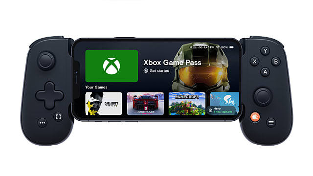 Front facing shot of the Backbone One connected to an iPhone, Xbox Game Pass on the screen.