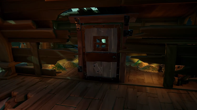 Gold in a pirate ship piled in the broken walls on either side of a large door. 