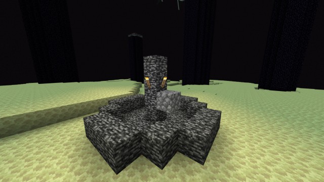 A bedrock fountain with torches in a desert biome in Minecraft.