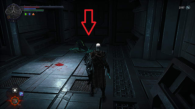 The spawn stands in a metal room with a dead fish enemy on the floor covered in green blood.