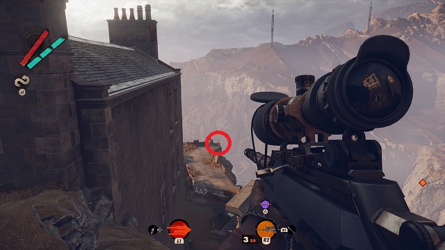 Aiming a sniper rifle at a character drinking beer near a railing overlooking a valley.