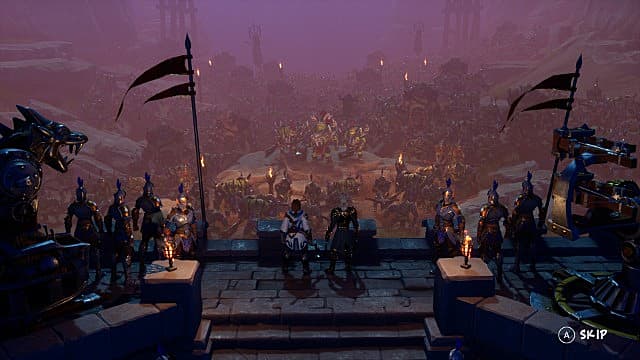 A human army stands on a castle rampart overlooking orcs below.