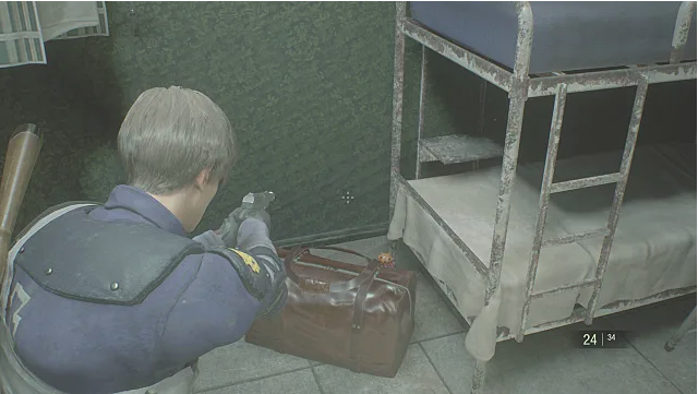 Leon aim his gun at a Mr. Raccoon that sits behind some luggage. 