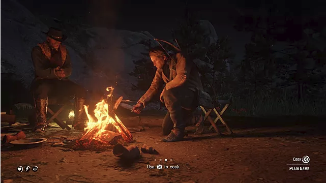 Arthur Morgan cooks meat over a fire at a campsite in Red Dead Redemption 2