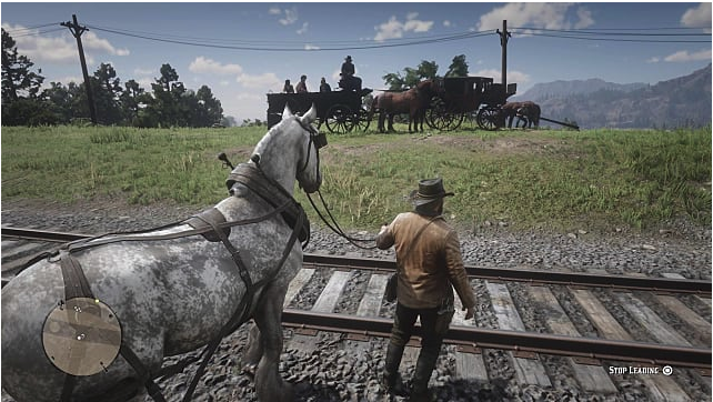 Arthur Morgan leads a horse across trains tracks