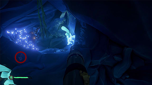 A lever to the left of a fallen mast by some blue, glowing flora.