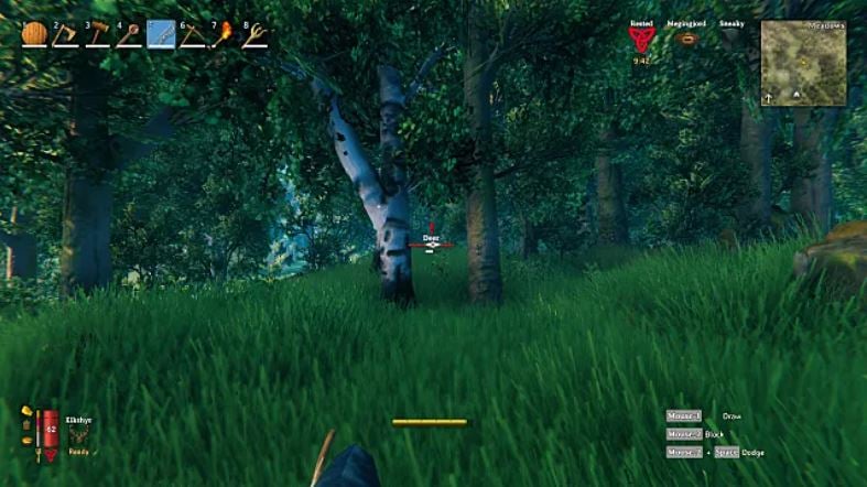 A player crouching in a forest, sneaking up on a deer.