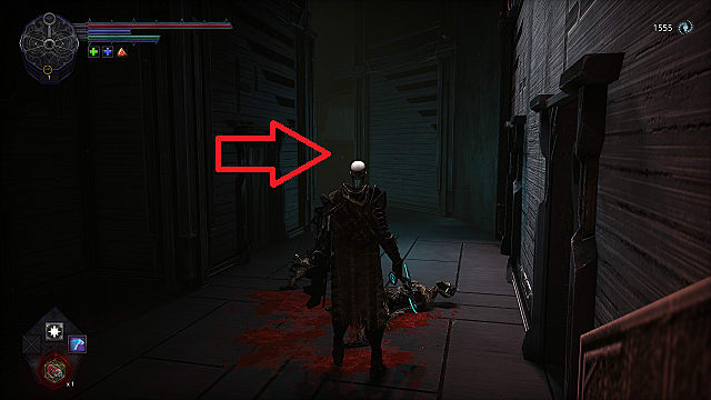 The player character standing in a tight hallway with two dead, bloody enemies lying on the ground.