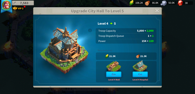 Upgrading the town hall, showing the hall's level, troop capacity, and power, as well as upgrades