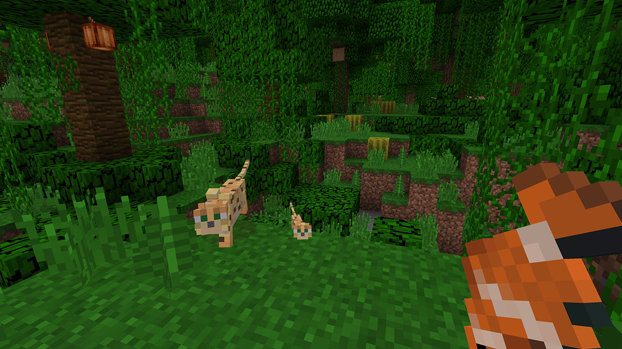 Minecraft Bedrock Edition in the Jungle about to feed an Ocelot a Fish